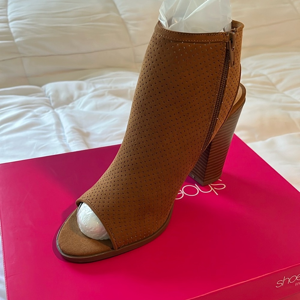Camel suede like sandal. Open toe and sling back heel with side zip closure.